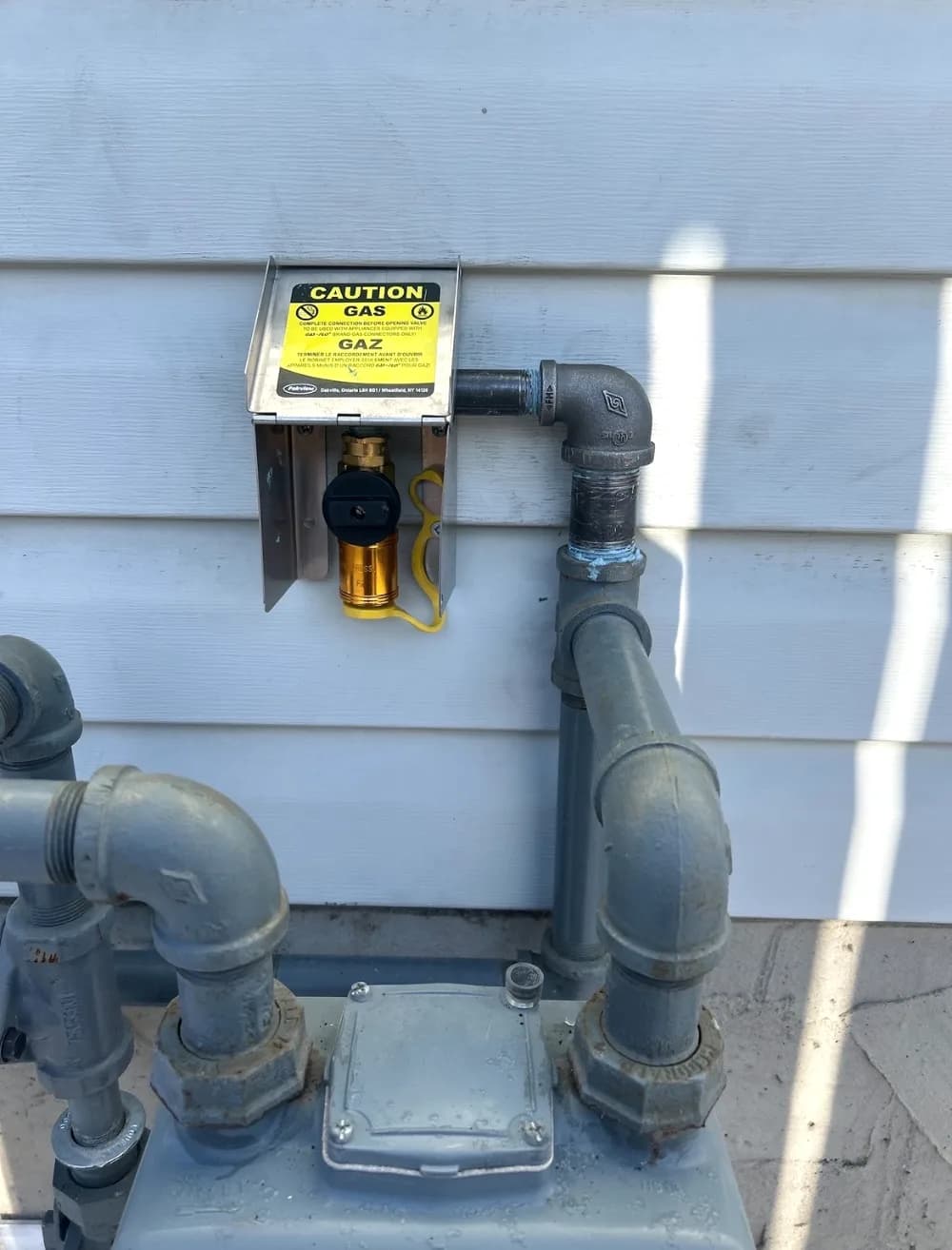 Residential gas line piping on a Calgary home