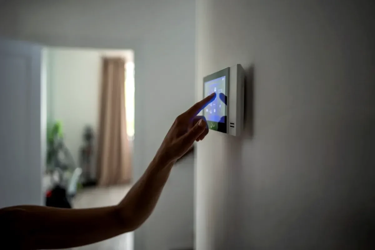 Smart thermostat mounted on a wall